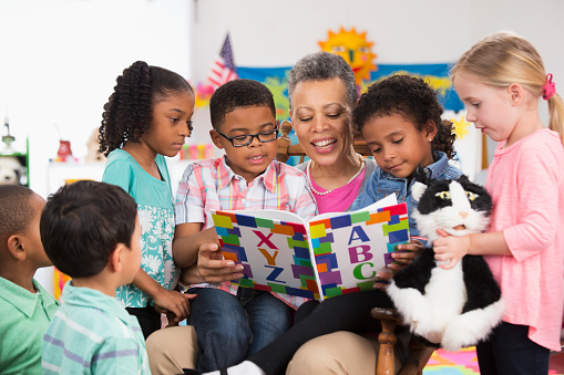 Teacher reading to children